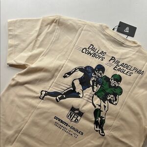 New Era Cream Tee with Navy Cowboys vs Eagles Graphic